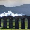 A steam train passes over the Ribblehead viaduct on the Settle to Carlisle line 
